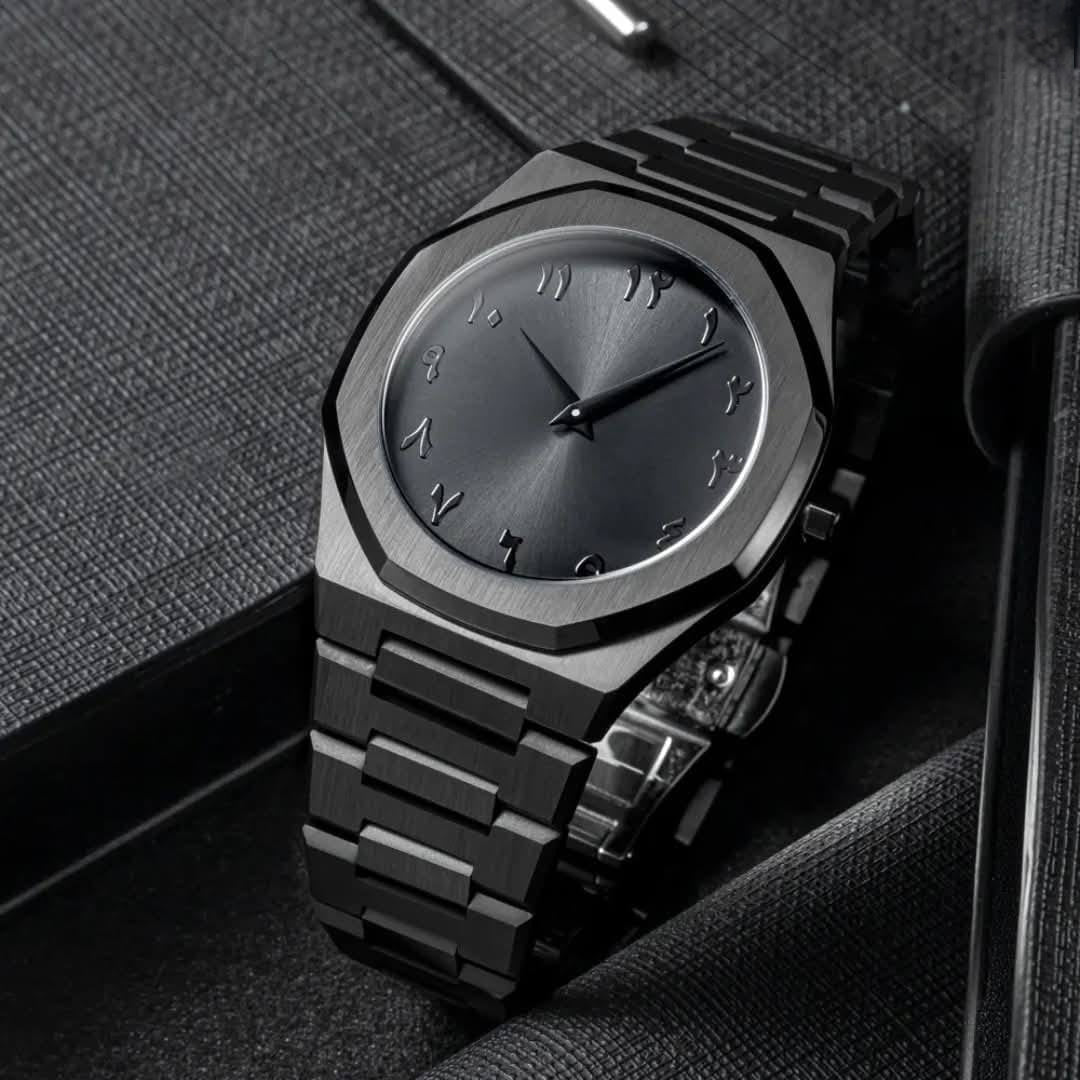Black wristwatch with a metallic finish on a textured surface